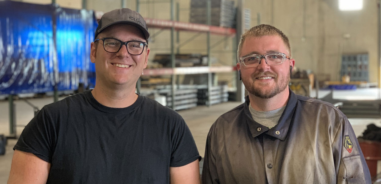Two Clyde employees in the shop